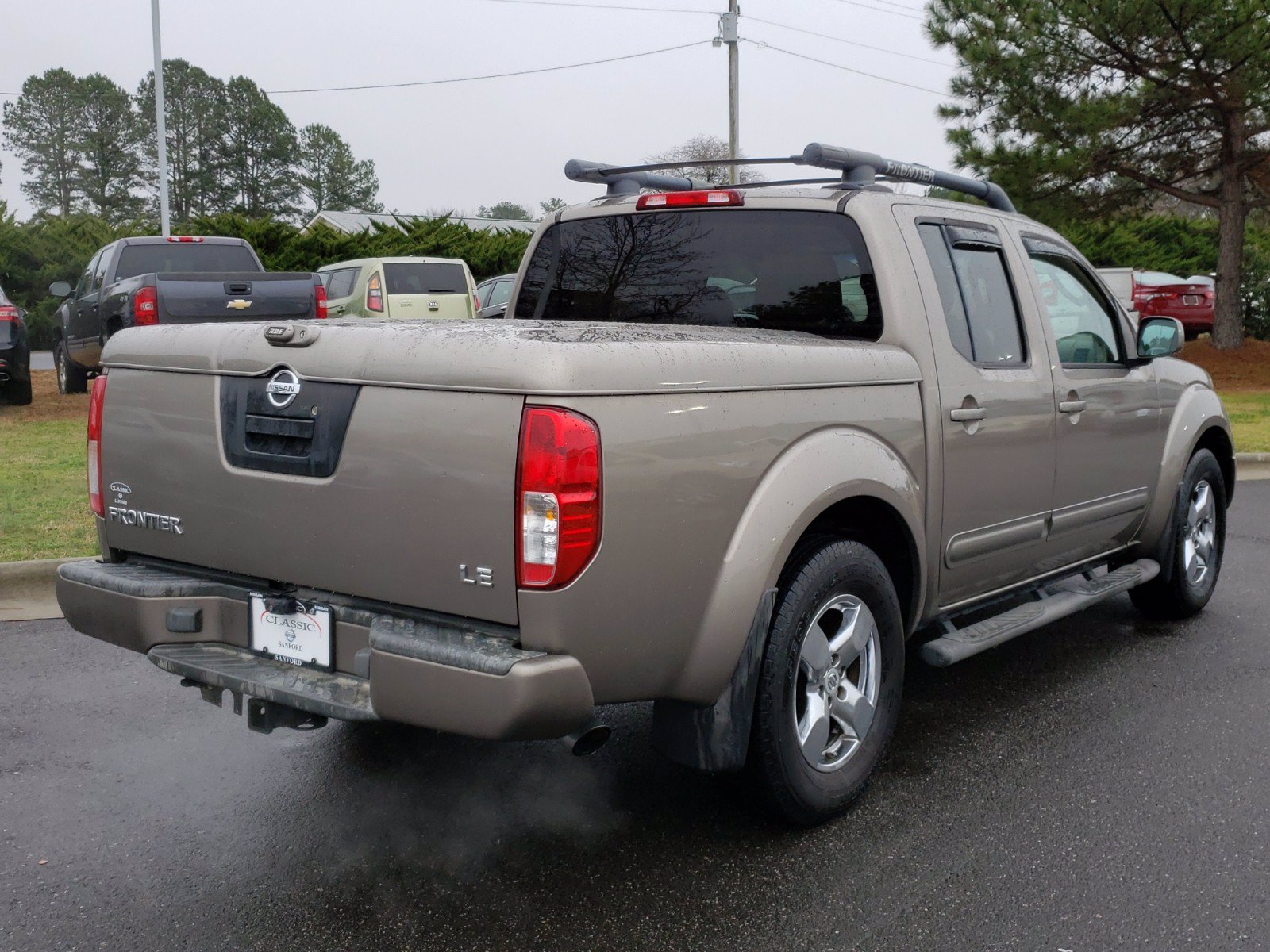 Pre-Owned 2005 Nissan Frontier 2WD LE RWD Crew Cab Pickup